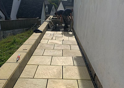 Pavement-laying Light Gold coloured Pavements construction in Devon.